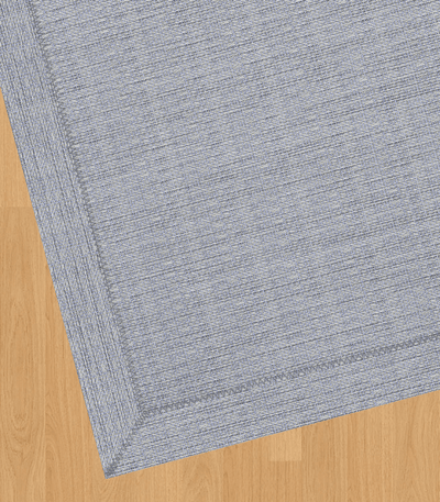 Premium woven vinyl rug on wooden floor.